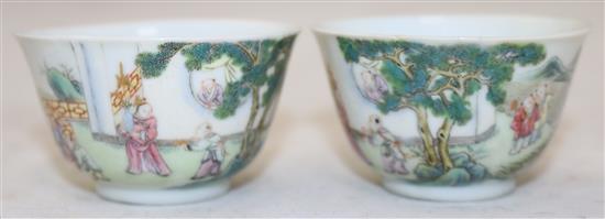 A pair of Chinese famille boys cups, Yongzheng marks, 18th/19th century, diameter 6.25cm, restored